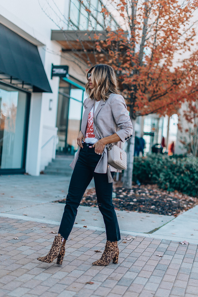 fashion blogger Vibe Magz wearing annie bing plaid blazer with graphic tee dark skinny jeans leopard print booties